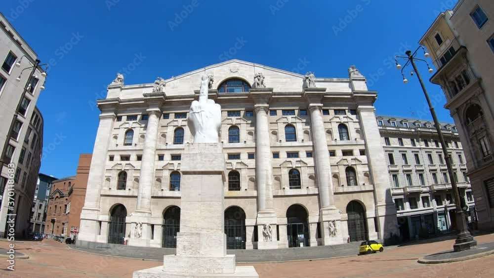 Milan, Italy - August 6, 2020: Lateral pan shot of the Italian stock exchange building in Milan Milan, Italy - August 6, 2020: Lateral pan shot of the Italian stock exchange building in Milan