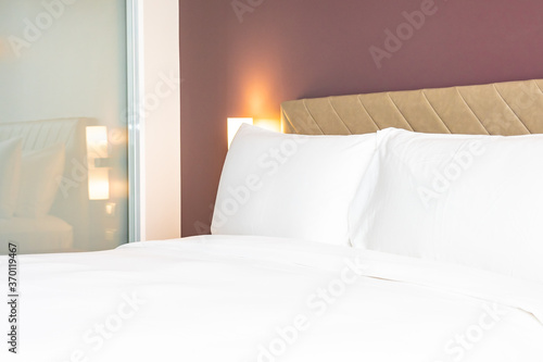 White color comfortable pillow and blanket on bed