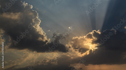 Sunset Cloudy Sky as the sunlight is passing through the clouds