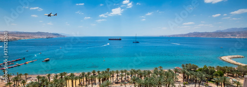 Panoramic image with a public beach at the Red Sea. Concept of unforgettable vacation and happy holiday