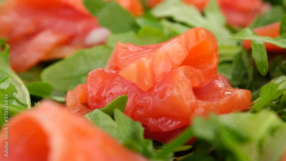 salmon. fresh sliced salmon and arugula salad rotating salmon. fresh sliced salmon and arugula salad rotating
