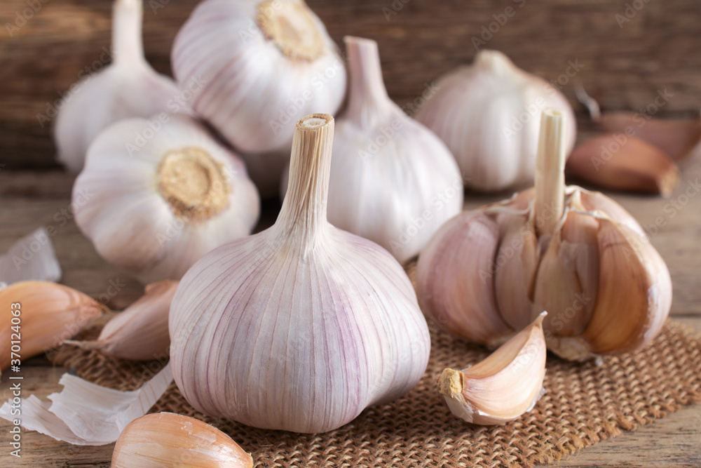 Close up,Fresh garlic on wooden background. Close up,Fresh garlic on wooden background.
