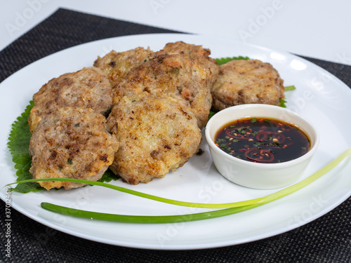 Korean food : Donjeonya(Donggeurangttaeng). A mixture of ground beef or pork and minced vegetables molded into round shapes, flour-coated, egg-battered, and pan-fried.