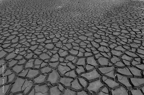 Earth ground crack with dust and rough dry surface texture ,Drought land lack of water. Global warming and greenhouse effect concept.