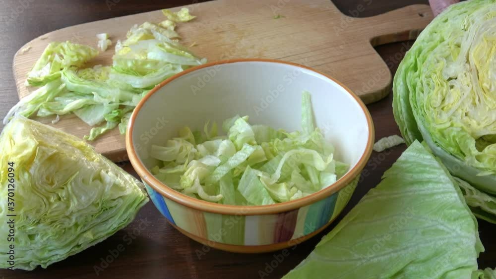 Iceberg lettuce fresh salad leaves.The geometric patterns of the leaves inside the heart of a cut and sliced lettuce (Lactuca sativa) salad
Iceberg lettuce fresh salad leaves.The geometric patterns of the leaves inside the heart of a cut and sliced lettuce (Lactuca sativa) salad