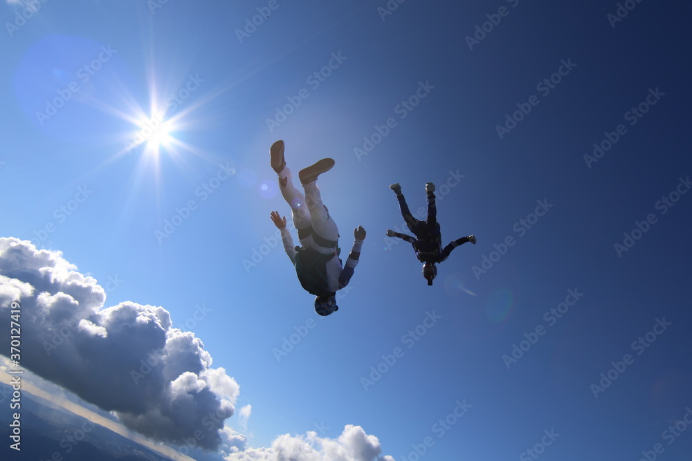 Skydivers over snowy mountains in Norway Skydivers over snowy mountains in Norway