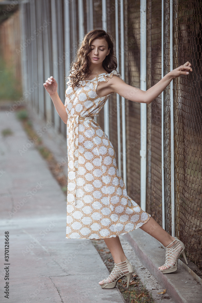 Fashionably dressed woman on the streets of a small Italian town Fashionably dressed woman on the streets of a small Italian town