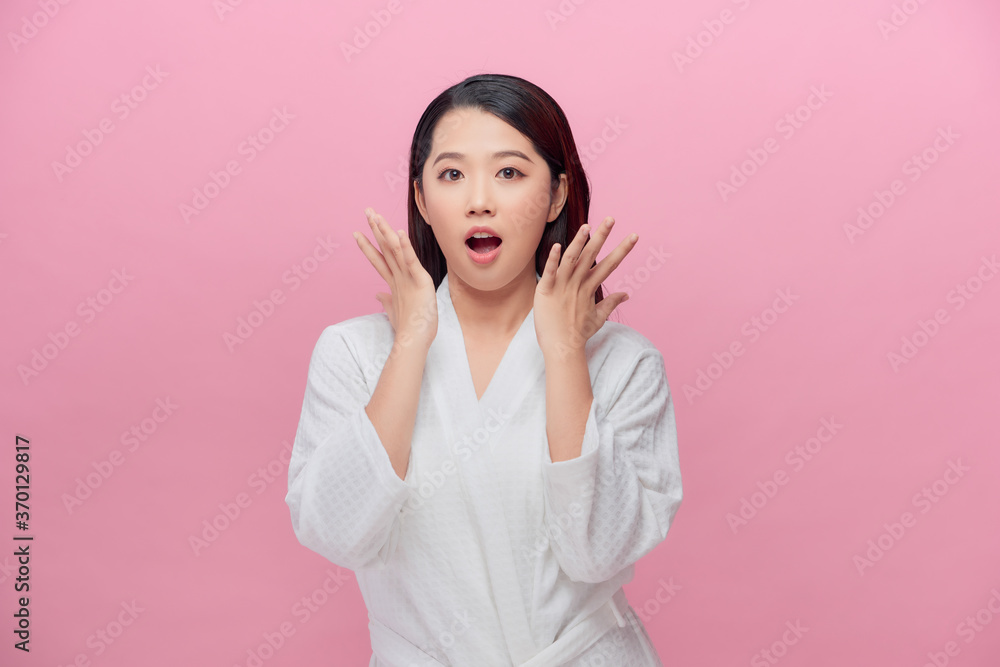 pretty young excited woman, isolated against pink background pretty young excited woman, isolated against pink background