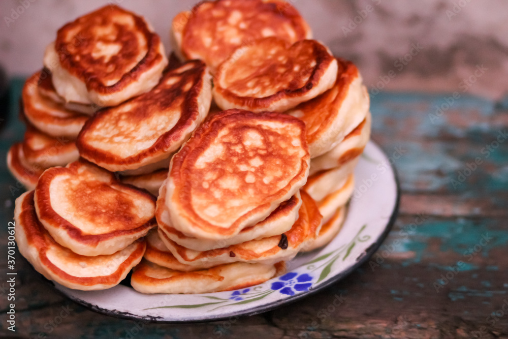Homemade pancakes are shot close-up from above