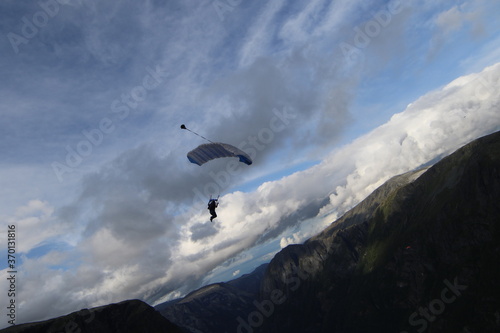 Skydivers over mountains in Norway © sindret