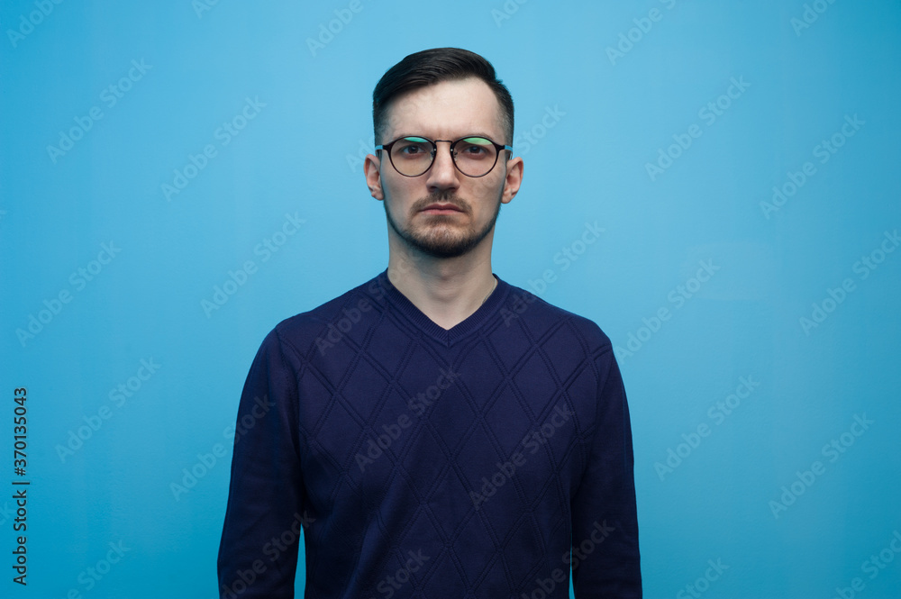 Fototapeta premium Serious young man in glasses