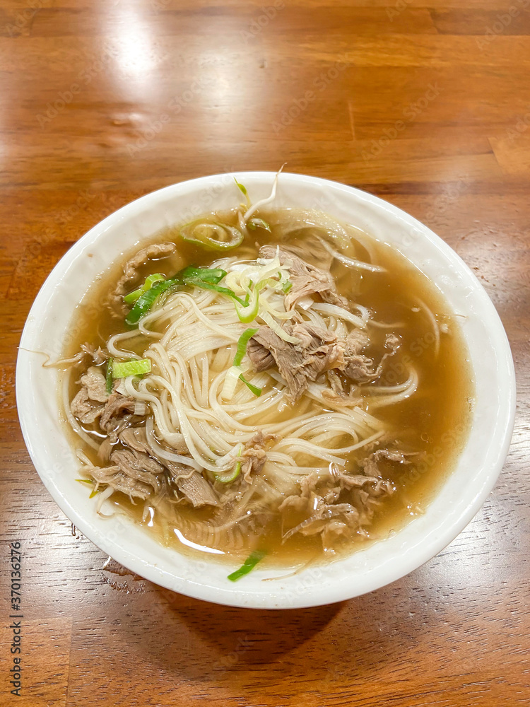 Beef noodle soup on wooden table Beef noodle soup on wooden table