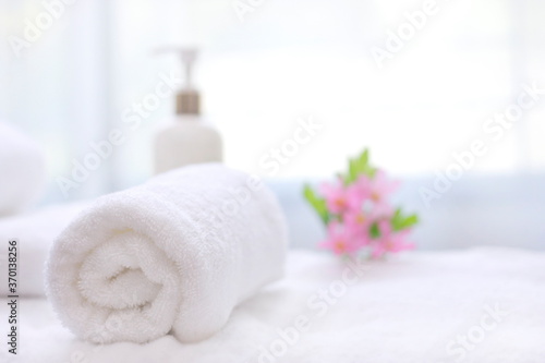 Fototapeta Naklejka Na Ścianę i Meble -  towel and soap,Spa accessories,Beautiful composition of spa , spa relax concept,  herbs for massage, beautiful spa set on wood table,For marketing products