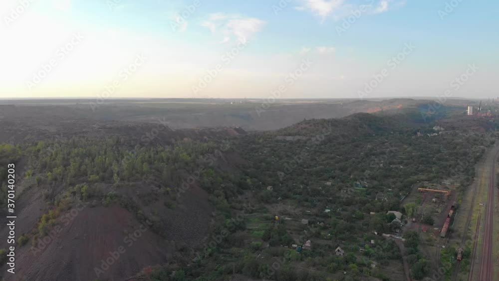 Quarry and railway red iron ore aerial drone left camera movement Krivoy Rog Ukraine Quarry and railway red iron ore aerial drone left camera movement Krivoy Rog Ukraine