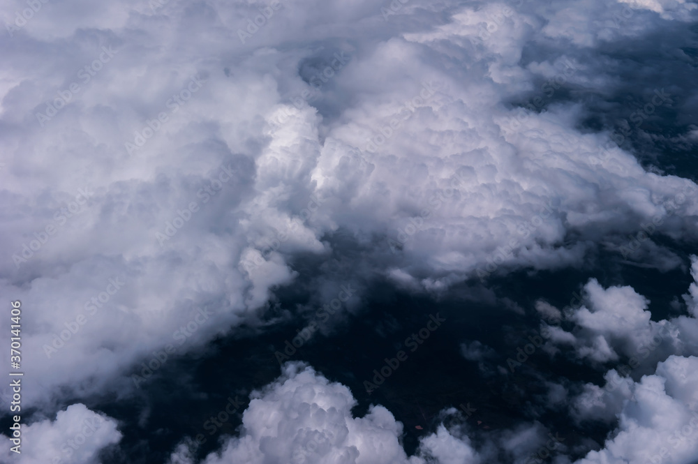 Obraz premium Aerial view of the fantastic and curious clouds, View on an airplane,