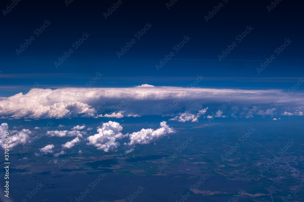 Aerial view of the fantastic and curious clouds, View on an airplane,