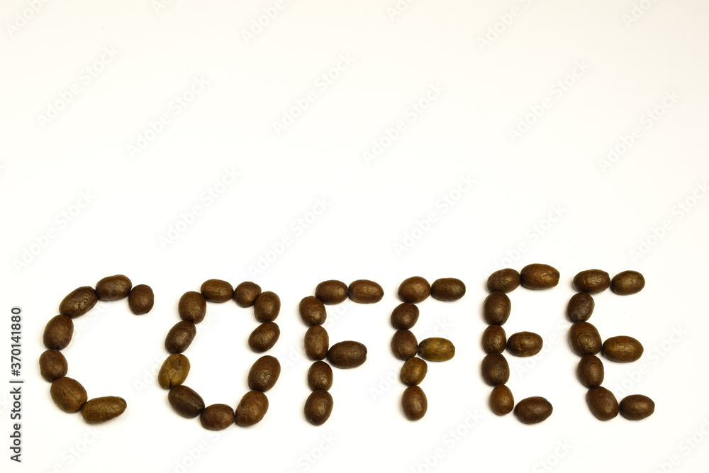 On white blank background coffee beans laid out word COFFEE On white blank background coffee beans laid out word COFFEE