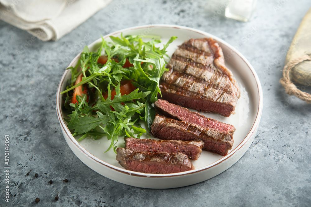 Grilled beef steak with green salad Grilled beef steak with green salad