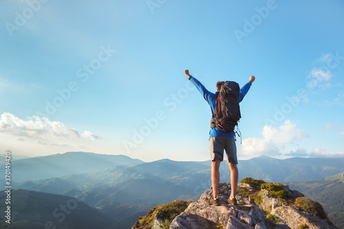Hiker on the top of the mountain, landscape view