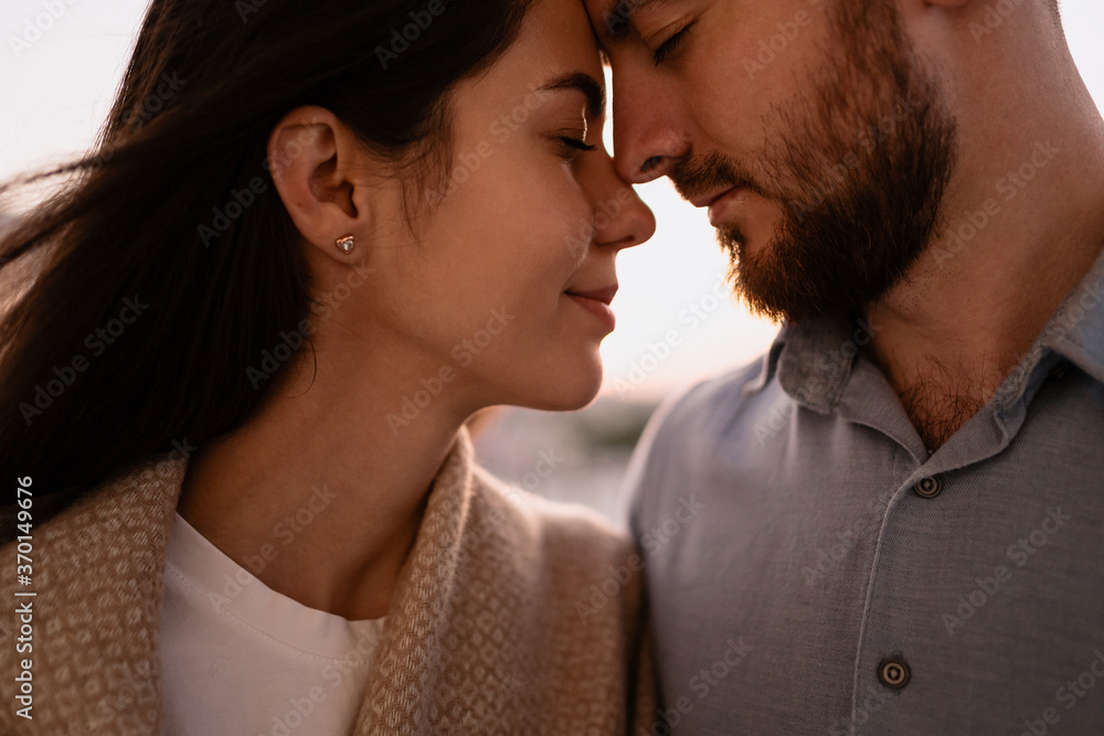 Portrait lovely couple hugging each other, smiling, enjoying time together. Emotional moments Portrait lovely couple hugging each other, smiling, enjoying time together. Emotional moments