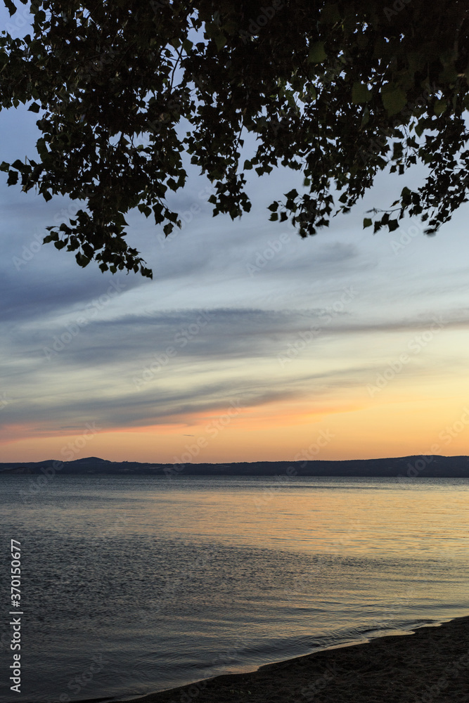 Lake Bolsena at sunset. colors, nature and a spectacular landscape Lake Bolsena at sunset. colors, nature and a spectacular landscape