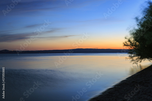 Wallpaper Mural Lake Bolsena at sunset. colors, nature and a spectacular landscape Torontodigital.ca
