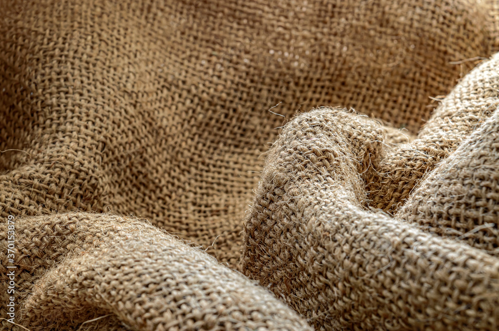 burlap texture fabric in folds background close up burlap texture fabric in folds background close up