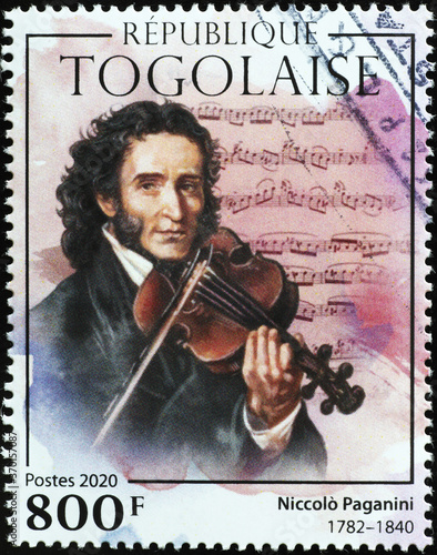 Niccolò Paganini with his violin on postage stamp photo