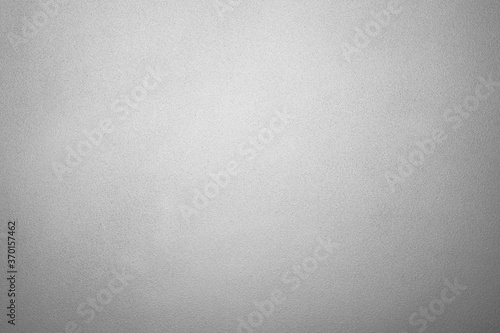 empty frosted glass or blank translucent window and dim wall in bathroom or shower room with white light vignette for black texture or dark background and opaque wallpaper photo