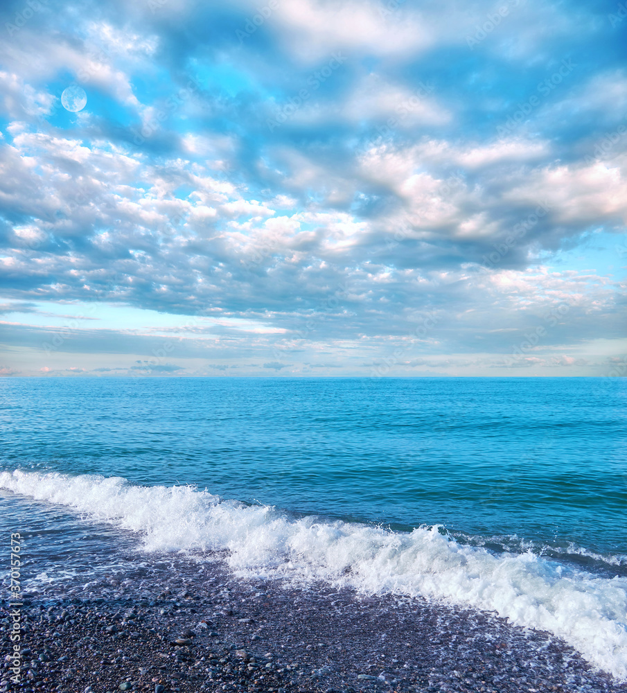 White waves of Black Sea with reflections of curly dramatic clouds White waves of Black Sea with reflections of curly dramatic clouds