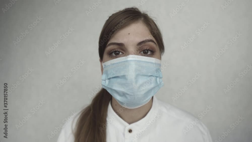 Female doctor during a coronavirus pandemic covid-19. Close portrait of a tired doctor Female doctor during a coronavirus pandemic covid-19. Close portrait of a tired doctor