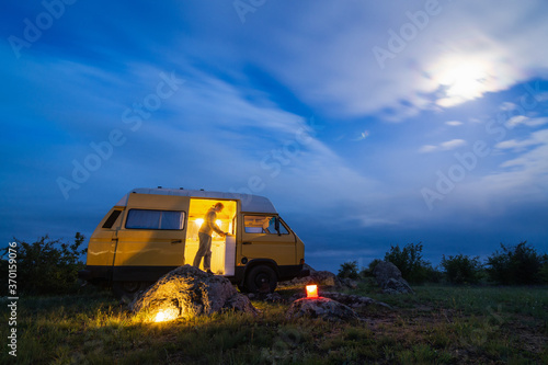 Valokuva Young blonde woman travelling by campervan though the countryside