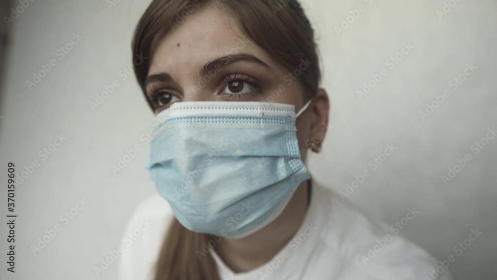 Female doctor during a coronavirus pandemic covid-19. Close portrait of a tired doctor Female doctor during a coronavirus pandemic covid-19. Close portrait of a tired doctor