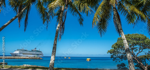 Mare, Fiji Island, view of Voyager of the Seas from the shore thru palm trees