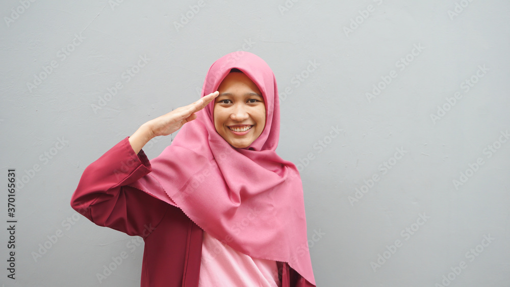 Asian hijab woman salutes to commemorate Independence Day Asian hijab woman salutes to commemorate Independence Day