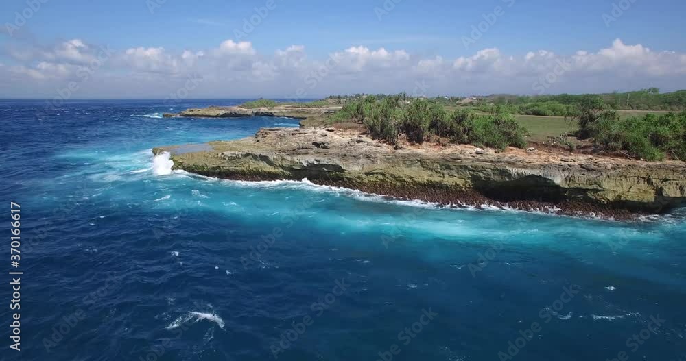 4K AERIAL DOLLY OF WAVES CRASHING INTO LIMESTONE ROCK CLIFFS 4K AERIAL DOLLY OF WAVES CRASHING INTO LIMESTONE ROCK CLIFFS