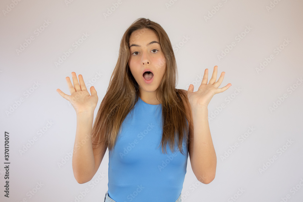 Pretty young girl making surprise gesture Pretty young girl making surprise gesture