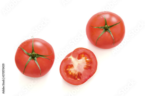 Top view of organic ripe tomatoes isolated on a white background.