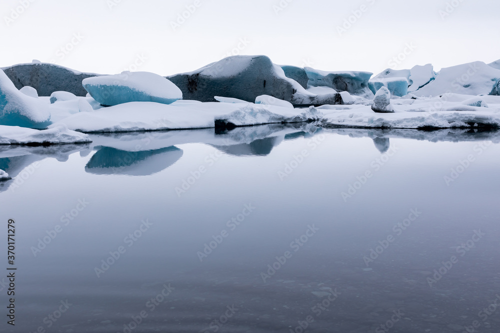 Panorama water on Winter Jokulsarlon Glacier is an icy beach where ice floes float
