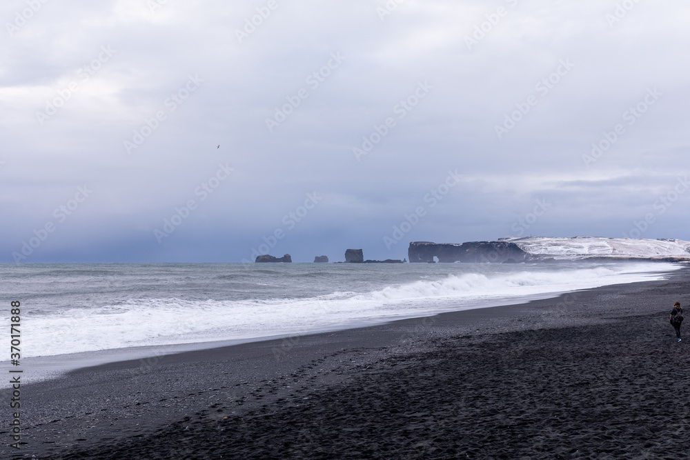 evening pictures of the panorama and waves of the winter Atlantic Ocean on Reynisfjara Choni beach