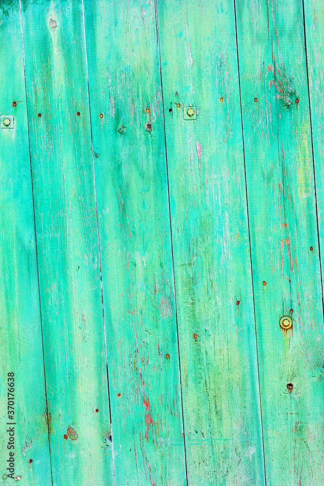 Background gloomy charred wooden fence in dark colors Background gloomy charred wooden fence in dark colors