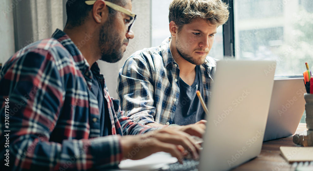 Group of young people working together. Creative business people in modern office. Hipster team in coworking. Young modern colleagues. Group of young people working together. Creative business people in modern office. Hipster team in coworking. Young modern colleagues.