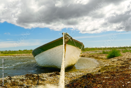 Fototapeta Naklejka Na Ścianę i Meble -  Fishing boat in the baltic sea in sand beach.