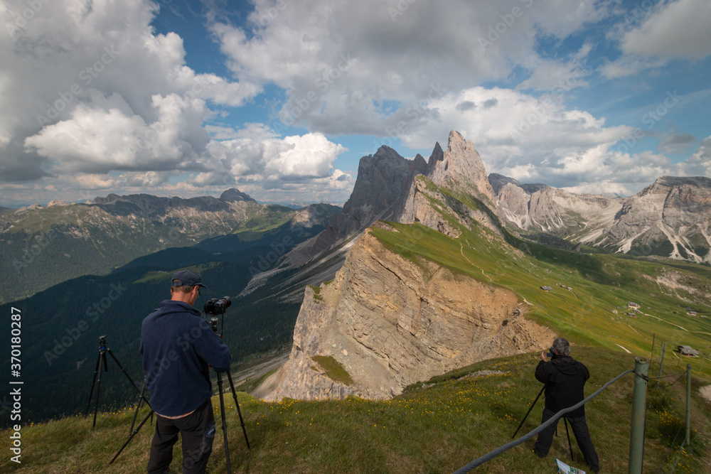 Photographers taking pictures of Odles group seen from Seceda.