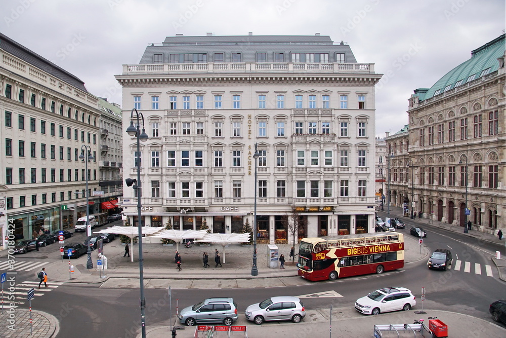 People, vehicle in front of cafe, hotel, state opera, on Albertina in the Innere Stadt (First District) of Vienna, Austria