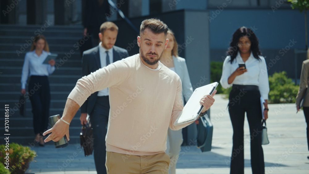 Obraz premium Cheerful nice guy office employee young businessman dancing with much fun on employment day. Excited bearded man receiving job approval celebrating.