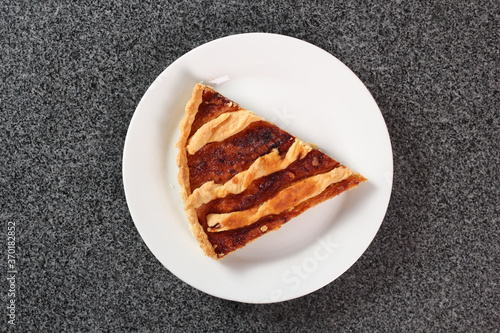 Shoofly Tart with Golden Syrup Filling on Granite Surface photo