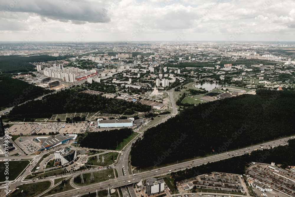 Top view aerial photo from flying drone of a Global City with development buildings, transportation, energy power infrastructure. Financial and business centers in Minsk, Belarus
