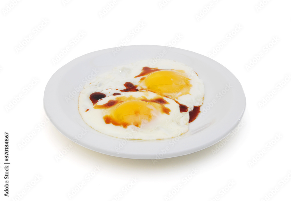 fried eggs in the place with soybean sauce on white fried eggs in the place with soybean sauce on white