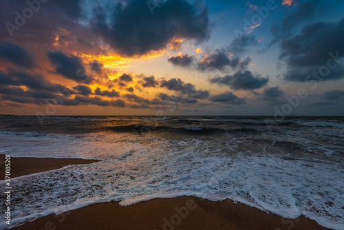 Beautiful colorful sunset on sea, summer evening beach